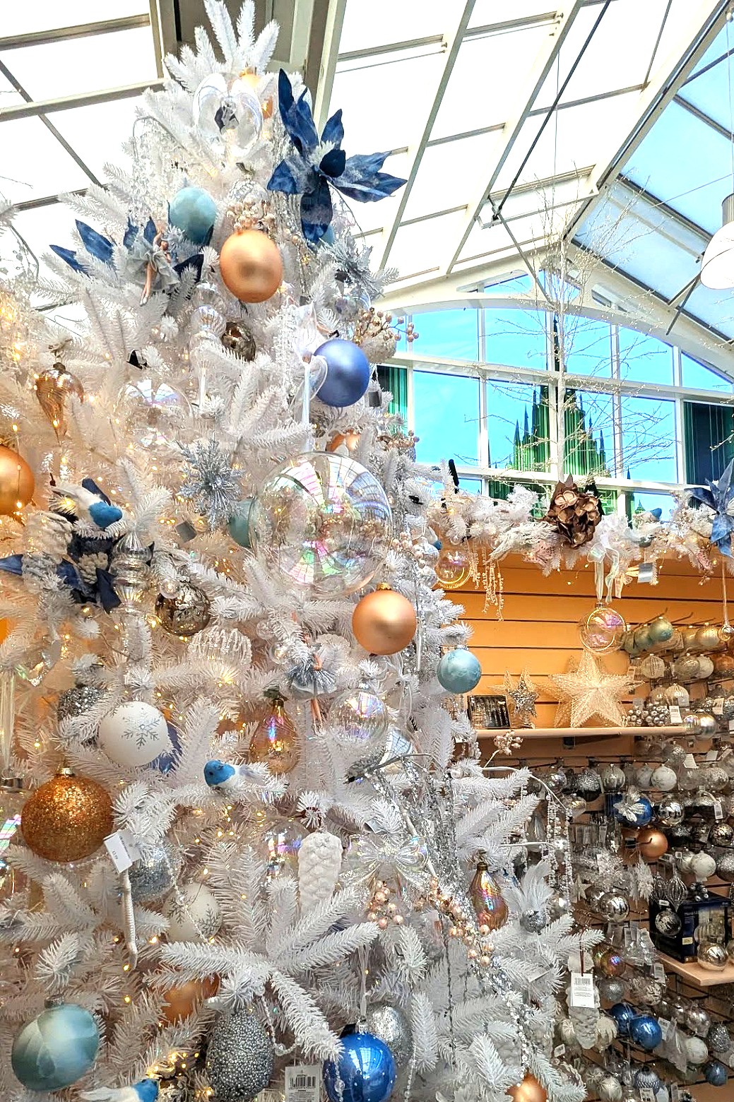 white christmas tree with pale pink and blue baubles