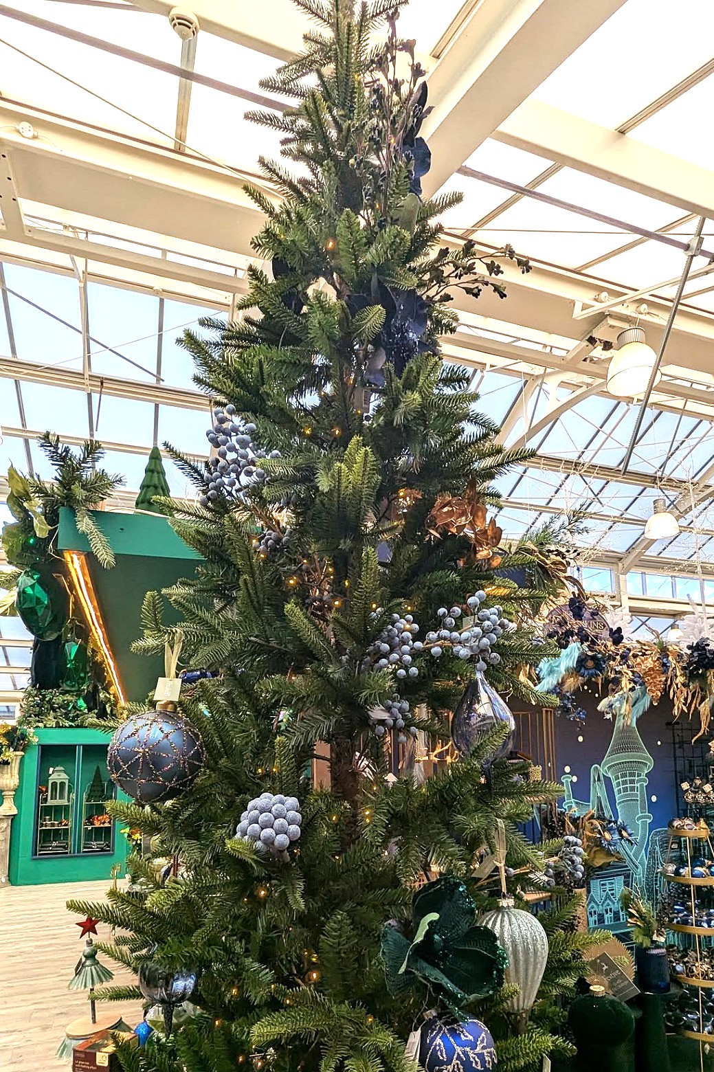 green Christmas tree with blue decorations