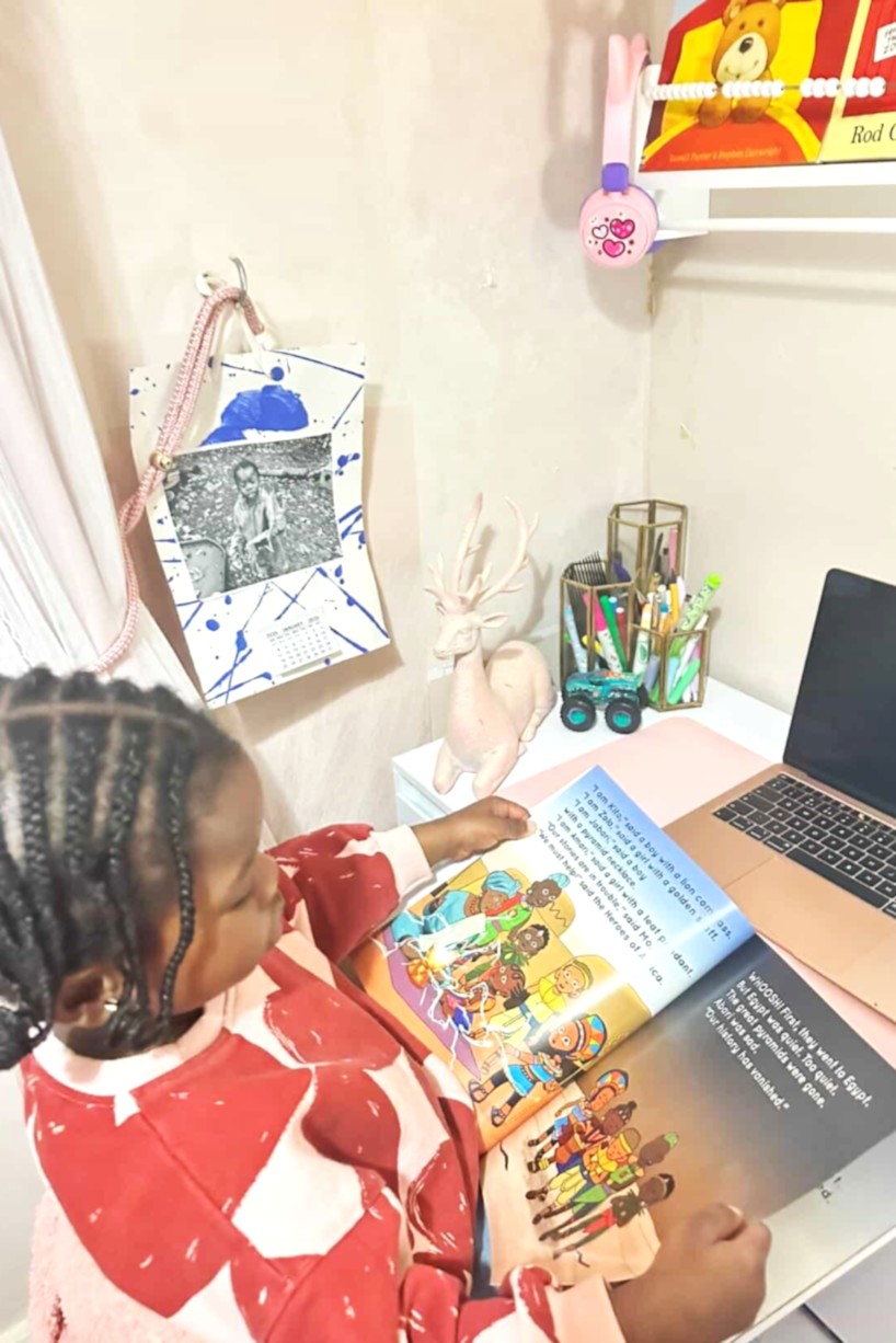 little black girl in a bedroom book nook