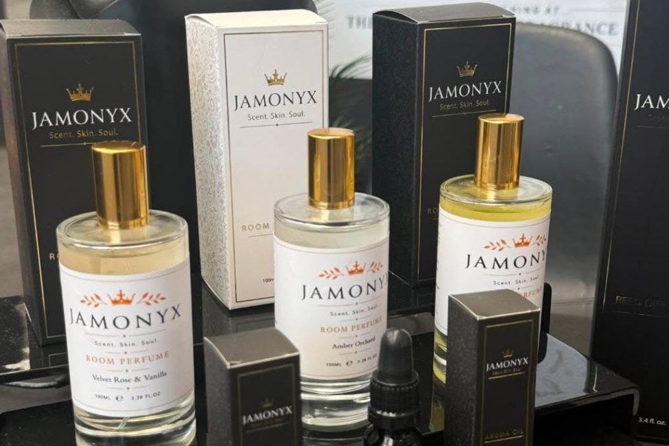 a selection of Jamonyx home fragrance on a table with black table cloth